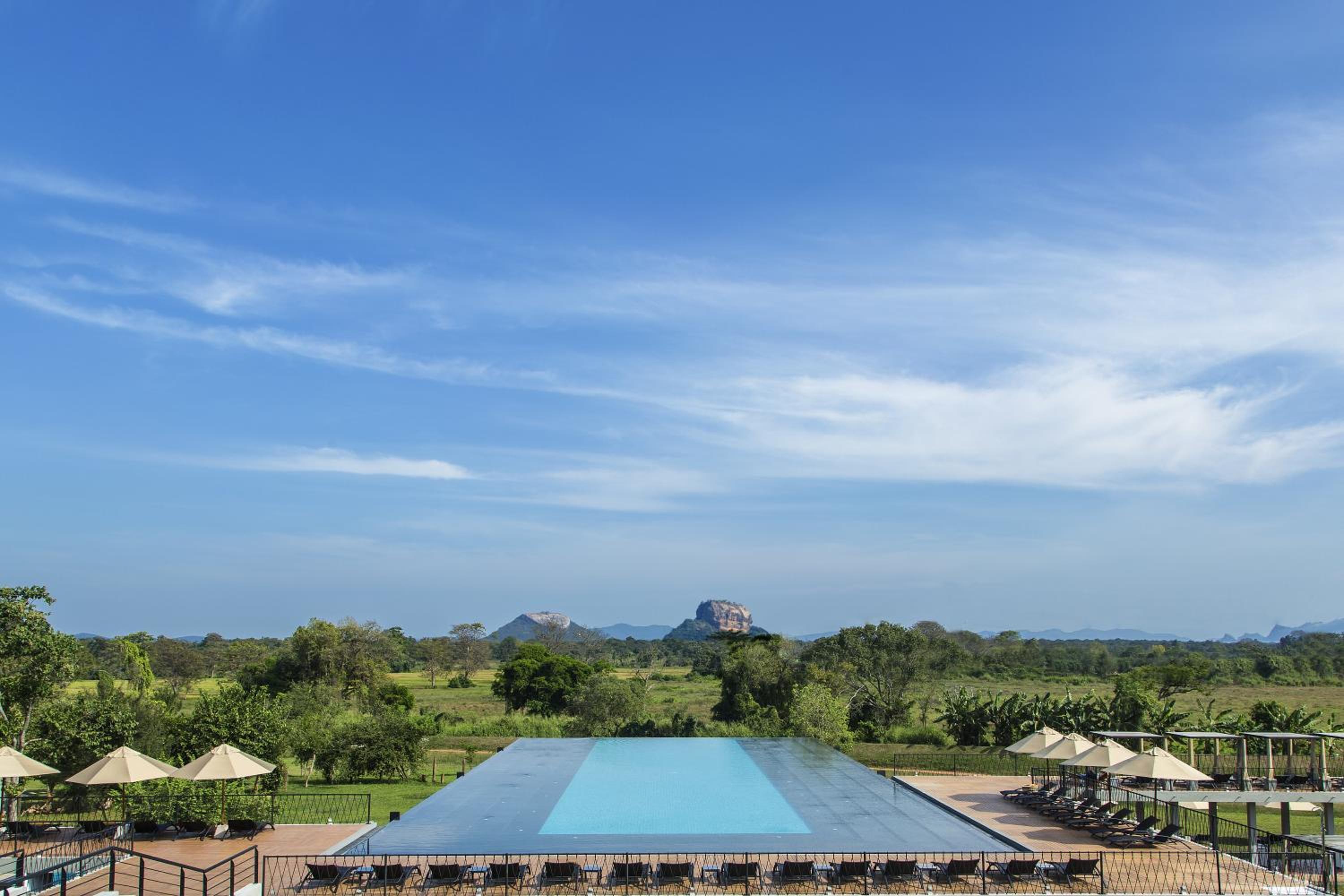 Aliya Resort & Spa — Infinity pool beneath Lion's Rock